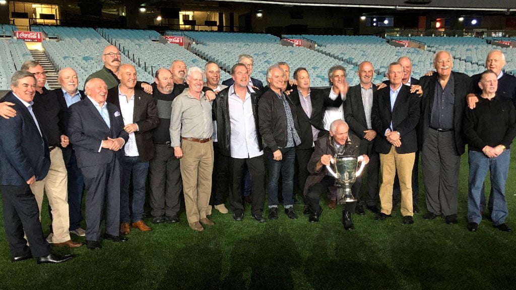 Former Carlton players and officials of the Premiership year of 1979 gather with the silverware on the MCG - Carlton,Carlton Blues,AFL
